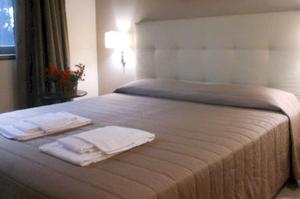 Postel nebo postele na pokoji v ubytování Hotel Desiderio