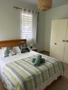 En eller flere senge i et værelse på Bord de Mer, Coco Fare Beach, Tahiti