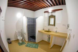 a bathroom with a sink and a toilet at Shauala Riad - Where History Lives in Fès