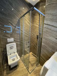 a shower stall in a bathroom with a toilet at Holiday home Shengjin k in Shëngjin +61 photos