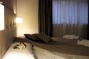 Postel nebo postele na pokoji v ubytování Hotel Desiderio