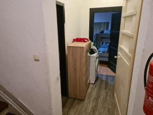 a room with a hallway with a door to a room at MonteurRoomMR in Essen +4 photos