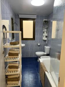 a bathroom with a sink and a toilet and a tub at La Llum de Serra in Serra +19 photos