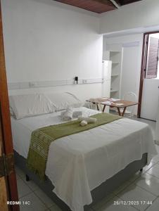 Postel nebo postele na pokoji v ubytování Apartamento com Quintal - Ar Cond - Ótima Localização