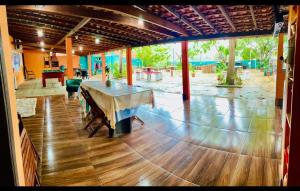 a large room with a table in the middle of it at Hospedagem Aconchego Do Lar in Barreirinhas