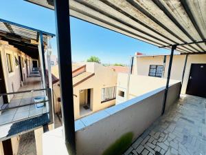 a view from the balcony of a building at SleepCozyGuestHouse in Soweto +5 photos