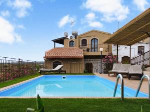 a swimming pool in the yard of a house at Elia Woodstone Houses in Elaía