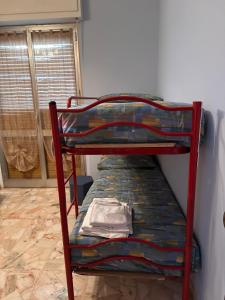 Giường trong phòng chung tại Casa Oceano - grazioso bilocale +4 ảnh