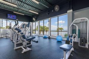 a gym with treadmills and cardio equipment and windows at Sandestin Golf and Beach Resort in Destin