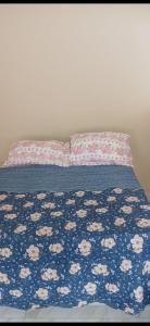 En eller flere senge i et værelse på Casa para temporada