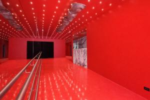 a bowling alley with red walls and lights at BA Millenium in Buenos Aires +20 photos