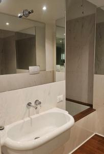 a bathroom with a sink and a mirror at Le Caravelle in Mestre
