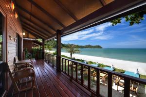a balcony of a house with a view of the beach at PingChan Koh Phangan Beachfront Resort in Thong Nai Pan Yai