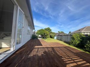 a deck on the side of a house at Cosy Corner in Hamilton