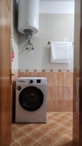 a washer and dryer in a bathroom at Spacious Waterfront 3BR - 2Bath & 3 Panoramic Balconies - Pogradec, Lake Ohrid in Pogradec +23 photos