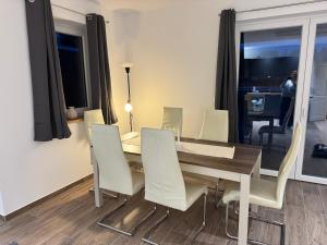 Et opholdsområde på Ferienhäuser Wintermoor + 5 billeder