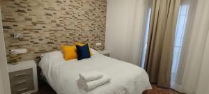 Giường trong phòng chung tại La Casa de la Mimosa