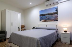 En eller flere senge i et værelse på Innmare Fortuna Hotel Dos Estrellas