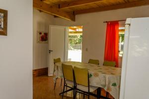 a dining room with a table and chairs at Quinta El Oasis in Junín