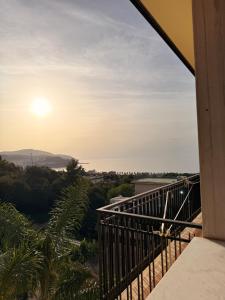 a balcony with a view of the sunset at Supramonte Guesthouse in Agropoli