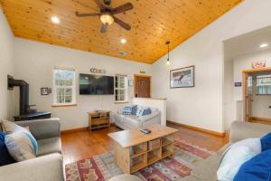 a living room with a couch and a table at Lookout Point - Retreat for 6 in South Lake Tahoe