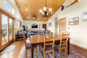 a dining room and living room with a table and chairs at Lookout Point - Retreat for 6 in South Lake Tahoe