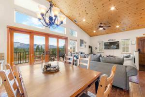 a living room with a table and a couch at Lookout Point - Retreat for 6 in South Lake Tahoe +25 photos