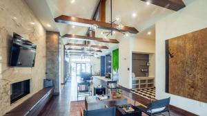 a living room with a couch and a fireplace at Landing Beautiful 2BD Pool Yoga Studio in Austin