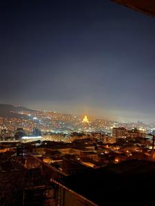 a view of a city at night with lights at Cosy City-View Flat in Mtatsminda, flat 7 in Itʼkhvisi