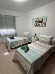 En eller flere senge i et værelse på Apartamento Cruz de Toledo