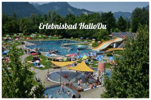 a group of people in a pool at a water park at Ferienwohnung Doppelreiter in Ebbs