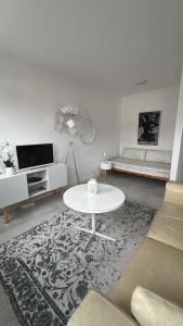 TV a/nebo společenská místnost v ubytování City Loft