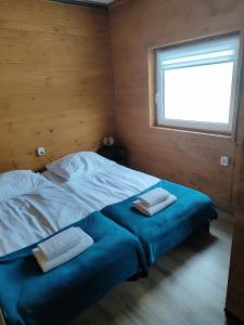En eller flere senge i et værelse på Chatka Niedźwiadka