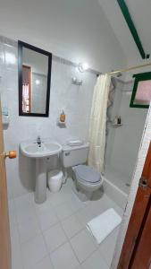 a bathroom with a sink toilet and a shower at Alta Vibracion Casa Boutique in Villa de Leyva +15 photos