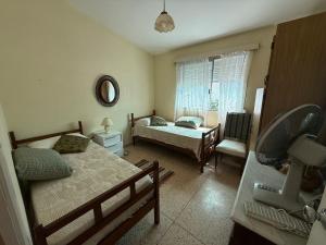 Postel nebo postele na pokoji v ubytování CASA en COSTA AZUL