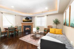 a living room with a couch and a fireplace at Cozy 1Bdrm•Self Check-in•Downtown in Salt Lake City