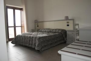 Ένα ή περισσότερα κρεβάτια σε δωμάτιο στο Agriturismo Terra Verde