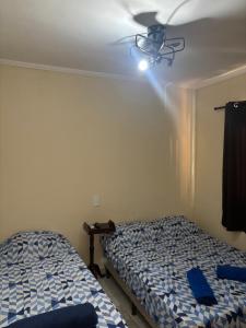 En eller flere senge i et værelse på Casa Central