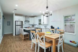 a kitchen and dining room with a table and chairs at Lone Star Landing in San Antonio