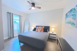 a bedroom with a bed and a ceiling fan at Lone Star Landing in San Antonio