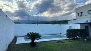 a house with a swimming pool in a yard at brisas del dique in San Fernando del Valle de Catamarca