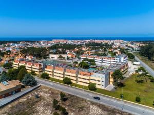 an aerial view of a city with buildings and the ocean at Furadouro pine beach apartment in Ovar