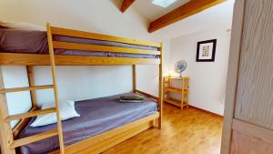 a bedroom with two bunk beds with a ladder at Villa BlueGreen in Coëx +27 photos