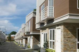 a row of houses on a street at Verdant Villas in Kaybagal