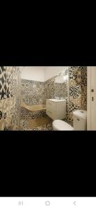 Koupelna v ubytování Appartement avec deux chambres et salon de massage