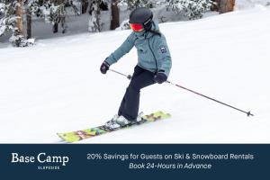a woman is skiing down a snow covered slope at The Sebastian - Vail in Vail