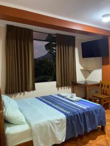 Giường trong phòng chung tại Casa Hospedaje Inkani