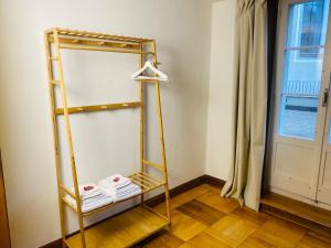 a shelf in a room with a window at Cara Nima Schwyz in Schwyz +32 photos