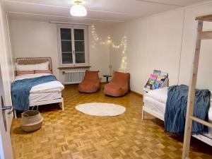 En eller flere senge i et værelse på Cara Nima Schwyz