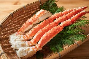 a basket of food with carrots on a table at Hotel Green Plaza Hakuba in Otari